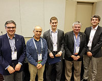 Miguel Anjos (ENRE president-elect), Hayri Onal (president), Goran Vojvodic (winner), Shmuel Oren (committee chair) and Steffen Rebennack (honorary mention) (l-r).