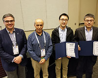 Miguel Anjos (ENRE president-elect), Hayri Onal (ENRE president) and prize-winners Shouqiang Wang and Peng Sun (l-r).