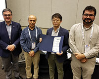 Miguel Anjos (ENRE president-elect), Hayri Onal (president), Tingju Zhu (winner) and Yu Wei (committee chair) (l-r).