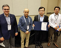 Miguel Anjos (ENRE president-elect), Hayri Onal (ENRE president), Soongeol Kwon (winner) and Ramteen Sioshansi (committee chair) (l-r).