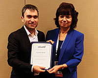 Gokhan Kirlik and judging committee chair Margaret Wiecek (l-r).
