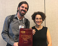 Prize-winner Robert Bray and MSOM President Wedad Elmaghraby (l-r).