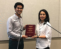 Prize-winner Antoine Desir and prize committee member Ozge Sahin (l-r).