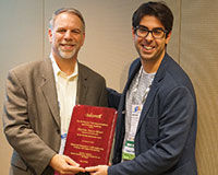 Eli Olinick (past president of Telecommunications and Network Analytics) and Martim Joyce-Moniz (l-r).