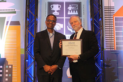 Then-INFORMS President Ramayya Krishnan (left) presents the 2019 INFORMS Prize for the Teaching of OR/MS Practice to Patrick Noonan.