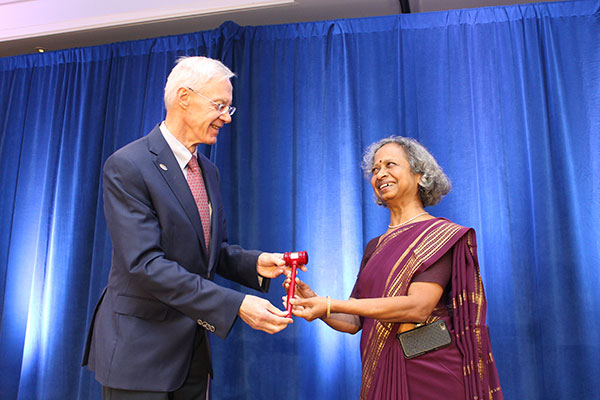 Gavel exchange Steve Graves and Radhika Kulkarni