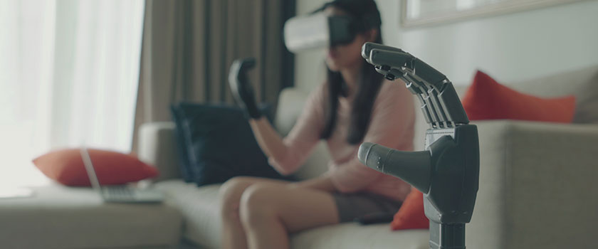 woman engineer creates robotic arm